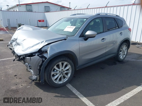 2014 Mazda CX-5 Grand Touring with VIN JM3KE4DY9E0375014, listed as a IAAI auction lot 42000382 with 110,584 mi miles and . Bid and sale history available at DreamBid. Image 19.