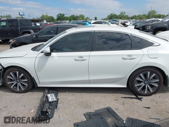 2024 Honda Civic EX z VIN 2HGFE1F7XRH323682, wystawiony jako IAAI lot #42019454 z przebiegiem 7 039 mil mil oraz . Historia ofert i sprzedaży dostępna na DreamBid. Obrazek 14.