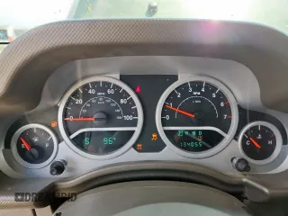 2008 Jeep Wrangler Unlimited Sahara with VIN 1J4GA59148L608970, listed as a Copart auction lot 64433495 with 134,055 mi miles and Salvage title. Bid and sale history available at DreamBid. Image 9.