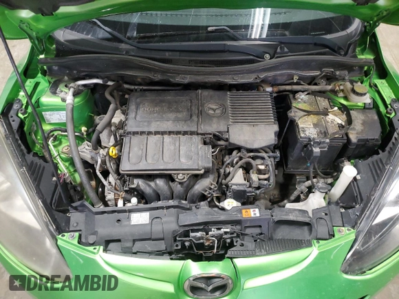 2012 Mazda 2 Sport with VIN JM1DE1KY9C0151578, listed as a Copart auction lot 52625055 with 123,812 mi miles and Salvage Title. Bid and sale history available at DreamBid. Image 11.