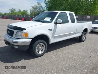 2001 Ford F-150 XL z VIN 1FTRX18W31KF80478, wystawiony jako IAAI lot #42219605 z przebiegiem 127 284 mil mil oraz . Historia ofert i sprzedaży dostępna na DreamBid. Obrazek 2.