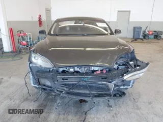 2014 Tesla Model S 60 with VIN 5YJSA1H13EFP49912, listed as a IAAI auction lot 41716661 with 129,776 mi miles and . Bid and sale history available at DreamBid. Image 13.