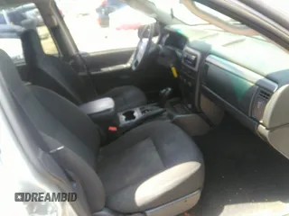 2004 Jeep Grand Cherokee Laredo z VIN 1J4GW48SX4C309998, wystawiony jako IAAI lot #42307167 z przebiegiem 306 912 mil mil oraz . Historia ofert i sprzedaży dostępna na DreamBid. Obrazek 5.