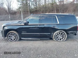 2016 GMC Yukon Denali with VIN 1GKS2CKJ2GR412201, listed as a IAAI auction lot 41185716 with 124,421 mi miles. Bid and sale history available at carsss.com. Image 14.