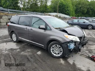 2015 Toyota Sienna XLE with VIN 5TDYK3DC4FS659692, listed as a Copart auction lot 57248355 with 121,644 mi miles and Salvage title. Bid and sale history available at DreamBid. Image 4.