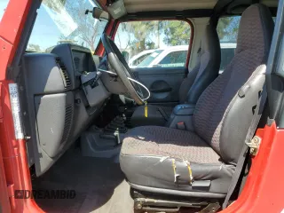 1999 Jeep Wrangler Sport with VIN 1J4FY19S7XP401120, listed as a Copart auction lot 64233665 with 129,708 mi miles and Salvage title. Bid and sale history available at DreamBid. Image 7.