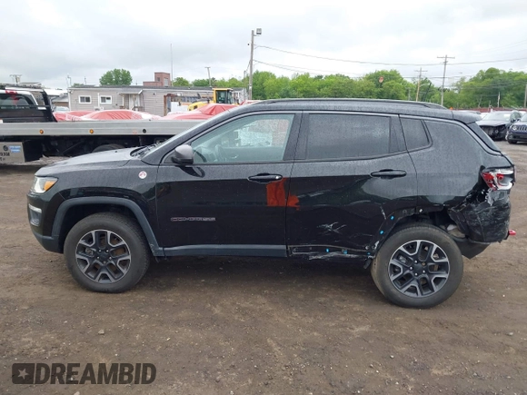 2019 Jeep Compass Trailhawk with VIN 3C4NJDDB7KT727762, listed as a IAAI auction lot 42299260 with 56,733 mi miles and . Bid and sale history available at DreamBid. Image 14.