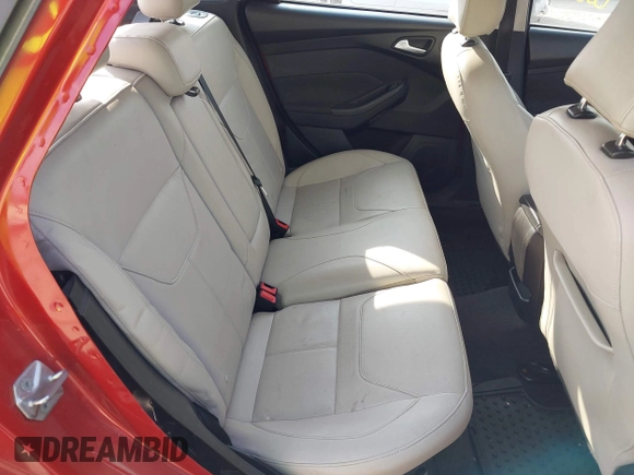 2018 Ford Focus Titanium z VIN 1FADP3N24JL313938, wystawiony jako IAAI lot #42050701 z przebiegiem 162 859 mil mil oraz . Historia ofert i sprzedaży dostępna na DreamBid. Obrazek 8.