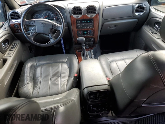 2004 GMC Envoy SLT z VIN 1GKDT13S042406662, wystawiony jako Copart lot #50523855 z przebiegiem 62 122 mil mil oraz Czysty tytuł • Clean title. Historia ofert i sprzedaży dostępna na DreamBid. Obrazek 8.