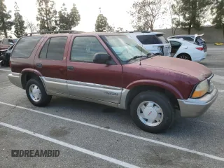 2000 GMC Jimmy SL with VIN 1GKCS13WXY2180539, listed as a Copart auction lot 89411665 with 167,674 mi miles and Salvage Title. Bid and sale history available at carsss.com. Image 4.