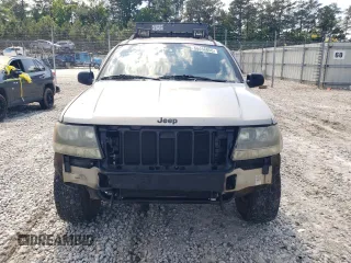 2004 Jeep Grand Cherokee Laredo z VIN 1J4GW48S84C177274, wystawiony jako Copart lot #56468855 z przebiegiem 236 014 mil mil oraz Szkoda całkowita • Salvage title. Historia ofert i sprzedaży dostępna na DreamBid. Obrazek 5.