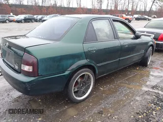 2000 Mazda Protege DX with VIN JM1BJ2225Y0255349, listed as a IAAI auction lot 41604895 with Not Provided miles and . Bid and sale history available at DreamBid. Image 4.