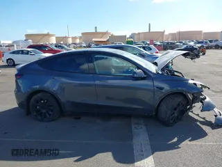 2023 Tesla Model Y Long Range z VIN 7SAYGAEE4PF945847, wystawiony jako IAAI lot #41071924 z przebiegiem 33 454 mil mil oraz . Historia ofert i sprzedaży dostępna na DreamBid. Obrazek 14.