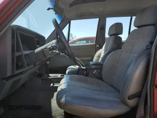 1992 Jeep Cherokee with VIN 1J4FJ58S0NL140995, listed as a Copart auction lot 56705875 with 253,657 mi miles and Salvage title. Bid and sale history available at DreamBid. Image 7.