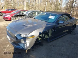 2023 Ford Mustang GT Premium z VIN 1FATP8FF0P5107393, wystawiony jako IAAI lot #41279324 z przebiegiem 26 622 mil mil oraz . Historia ofert i sprzedaży dostępna na DreamBid. Obrazek 2.