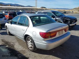 2002 Saturn SL with VIN 1G8ZK52742Z178494, listed as a IAAI auction lot 41408870 with 115,164 mi miles. Bid and sale history available at carsss.com. Image 3.