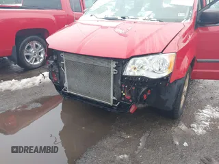 2014 Dodge Grand Caravan American Value with VIN 2C4RDGBG0ER452719, listed as a IAAI auction lot 41547145 with 151,636 mi miles and . Bid and sale history available at DreamBid. Image 6.