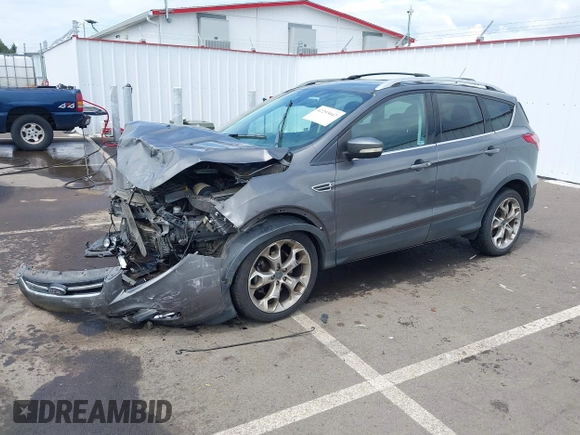 2013 Ford Escape Titanium with VIN 1FMCU9J95DUC95061, listed as a IAAI auction lot 42293047 with 124,641 mi miles and . Bid and sale history available at DreamBid. Image 2.