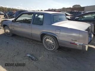 1990 Cadillac DeVille z VIN 1G6CD1339L4358825, wystawiony jako Copart lot #76901884 z przebiegiem 169 956 mil mil oraz Szkoda całkowita • Salvage title. Historia ofert i sprzedaży dostępna na DreamBid. Obrazek 2.