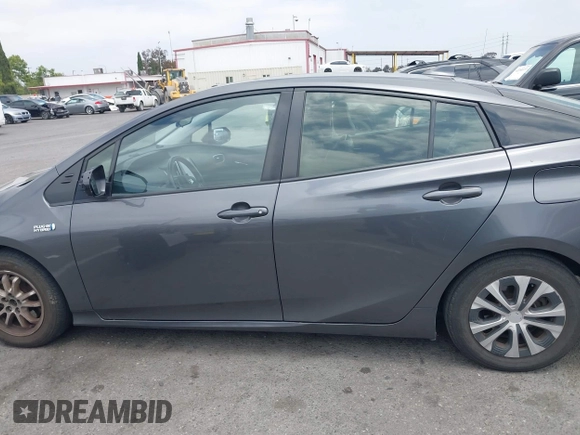 2021 Toyota Prius LE with VIN JTDKAMFP0M3193305, listed as a IAAI auction lot 42283494 with 322,523 mi miles and . Bid and sale history available at DreamBid. Image 14.