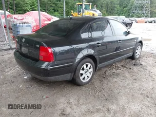 1999 Volkswagen Passat GL z VIN WVWMD63B2XE351611, wystawiony jako IAAI lot #42308007 z przebiegiem 180 893 mil mil oraz . Historia ofert i sprzedaży dostępna na DreamBid. Obrazek 4.