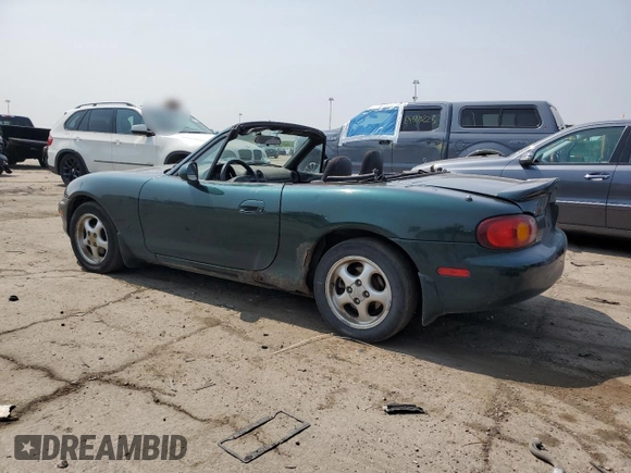 2000 Mazda MX-5 Miata with VIN JM1NB3533Y0151883, listed as a Copart auction lot 64423925 with 180,275 mi miles and Salvage title. Bid and sale history available at DreamBid. Image 2.