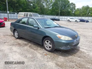 2002 Toyota Camry LE z VIN JTDBE32K920007008, wystawiony jako IAAI lot #42496951 z przebiegiem 525 335 mil mil oraz . Historia ofert i sprzedaży dostępna na DreamBid. Obrazek 1.