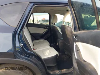 2016 Mazda CX-5 Grand Touring with VIN JM3KE4DY1G0823989, listed as a IAAI auction lot 41770149 with 40,677 mi miles. Bid and sale history available at carsss.com. Image 8.