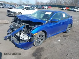 2018 Honda Civic Si z VIN 2HGFC1E52JH709085, wystawiony jako IAAI lot #42069894 z przebiegiem 65 427 mil mil oraz . Historia ofert i sprzedaży dostępna na DreamBid. Obrazek 2.