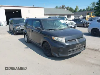2011 Scion xB with VIN JTLZE4FE9B1118729, listed as a IAAI auction lot 40312454 with 129,260 mi miles. Bid and sale history available at carsss.com. Image 1.