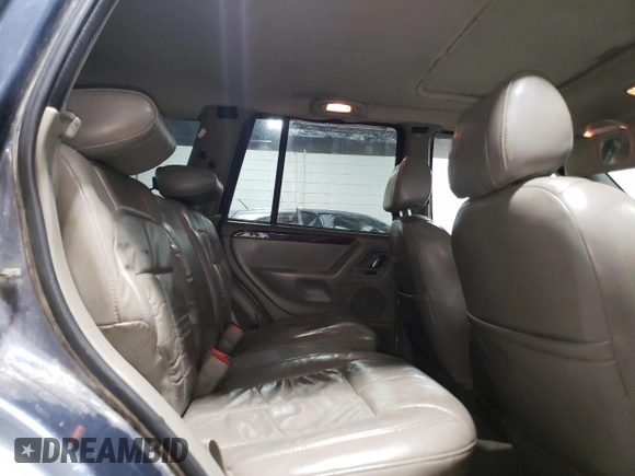 2001 Jeep Grand Cherokee Limited with VIN 1J4GW58N01C664996, listed as a Copart auction lot 58339825 with 288,153 mi miles and Salvage title. Bid and sale history available at DreamBid. Image 11.