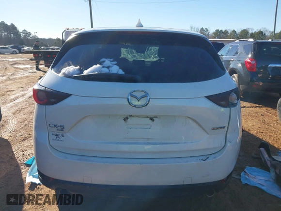 2020 Mazda CX-5 Touring with VIN JM3KFBCM0L0828207, listed as a IAAI auction lot 41305801 with 56,500 mi miles and . Bid and sale history available at DreamBid. Image 16.