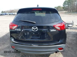 2014 Mazda CX-5 Touring with VIN JM3KE2CY9E0333951, listed as a IAAI auction lot 41825345 with 124,684 mi miles. Bid and sale history available at carsss.com. Image 16.
