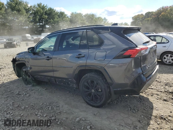 2023 Toyota RAV4 Hybrid XSE with VIN 4T3E6RFV1PU112579, listed as a Copart auction lot 74387924 with 103,340 mi miles and Salvage title. Bid and sale history available at DreamBid. Image 2.