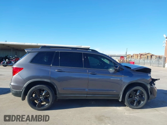 2019 Honda Passport Elite z VIN 5FNYF8H07KB015720, wystawiony jako IAAI lot #41221298 z przebiegiem 65 747 mil mil oraz . Historia ofert i sprzedaży dostępna na DreamBid. Obrazek 14.