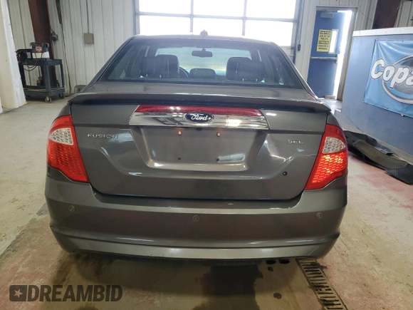 2012 Ford Fusion SEL with VIN 3FAHP0JA1CR281869, listed as a Copart auction lot 52486365 with 124,312 mi miles and Salvage Title. Bid and sale history available at carsss.com. Image 6.
