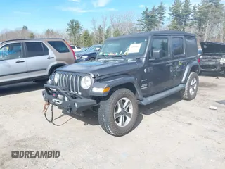 2018 Jeep Wrangler Unlimited Sahara with VIN 1C4HJXEG0JW246110, listed as a IAAI auction lot 41826662 with 65,236 mi miles. Bid and sale history available at carsss.com. Image 17.