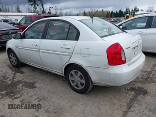 2007 Hyundai Accent GLS with VIN KMHCN46C67U097159, listed as a IAAI auction lot 41913373 with 103,303 mi miles. Bid and sale history available at carsss.com. Image 3.