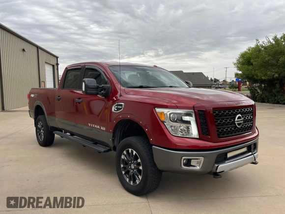 2016 Nissan Titan Pro-4X z VIN 1N6BA1F40GN516889, wystawiony jako Copart lot #72827234 z przebiegiem 123 706 mil mil oraz Czysty tytuł • Clean title. Historia ofert i sprzedaży dostępna na DreamBid. Obrazek 1.