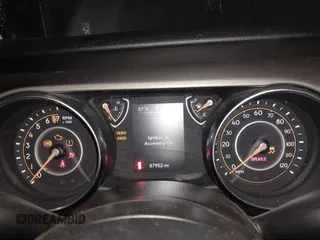 2021 Jeep Wrangler Sport S with VIN 1C4HJXAG2MW502452, listed as a IAAI auction lot 42031159 with 87,952 mi miles and . Bid and sale history available at DreamBid. Image 7.