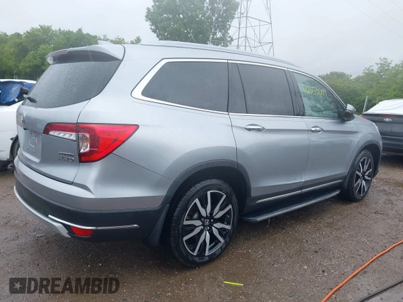 2019 Honda Pilot Touring 8-Passenger with VIN 5FNYF6H98KB097105, listed as a IAAI auction lot 42353009 with 133,212 mi miles and . Bid and sale history available at DreamBid. Image 4.