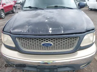 2000 Ford F-150 XL with VIN 1FTRX18L1YNA08999, listed as a IAAI auction lot 41988747 with 214,201 mi miles. Bid and sale history available at carsss.com. Image 12.