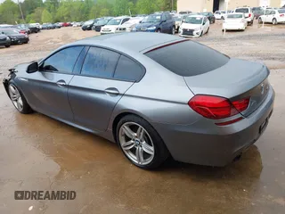 2016 BMW 6 Series 640i xDrive with VIN WBA6D2C58GGT66160, listed as a IAAI auction lot 41130666 with 102,064 mi miles and . Bid and sale history available at carsss.com. Image 3.
