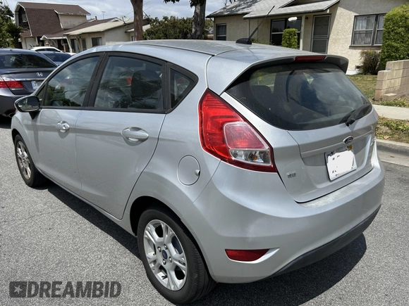 2015 Ford Fiesta SE z VIN 3FADP4EJ8FM167515, wystawiony jako IAAI lot #42153873 z przebiegiem 100 559 mil mil oraz . Historia ofert i sprzedaży dostępna na DreamBid. Obrazek 3.