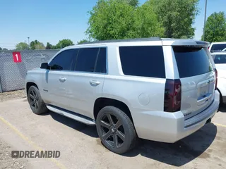 2015 Chevrolet Tahoe LT with VIN 1GNSCBKC9FR111001, listed as a IAAI auction lot 42440624 with 128,087 mi miles and . Bid and sale history available at DreamBid. Image 3.