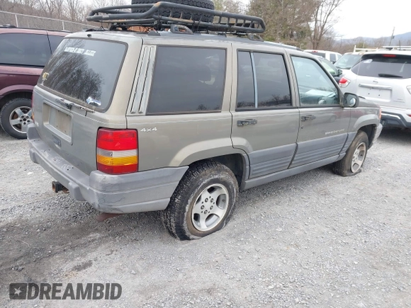 1996 Jeep Grand Cherokee with VIN 1J4EZ58S1TC112995, listed as a IAAI auction lot 41706966 with 356,727 mi miles and . Bid and sale history available at DreamBid. Image 4.