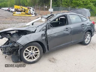 2016 Ford Focus SE z VIN 1FADP3F22GL327604, wystawiony jako IAAI lot #42319889 z przebiegiem 97 736 mil mil oraz . Historia ofert i sprzedaży dostępna na DreamBid. Obrazek 6.