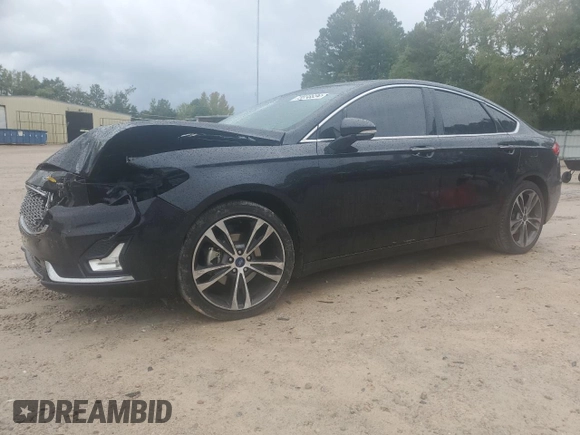 2019 Ford Fusion Titanium with VIN 3FA6P0K9XKR217324, listed as a Copart auction lot 56104185 with 135,728 mi miles and Salvage title. Bid and sale history available at DreamBid. Image 1.