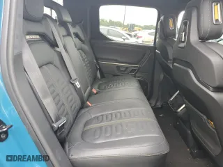 2023 Rivian R1T Adventure with VIN 7FCTGBAA5PN026063, listed as a Copart auction lot 66916194 with 0 mi miles and Salvage Title. Bid and sale history available at carsss.com. Image 10.