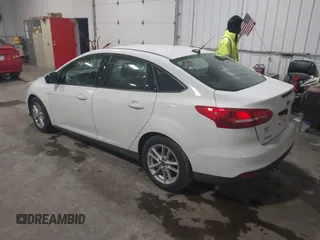 2018 Ford Focus SE with VIN 1FADP3F29JL312721, listed as a IAAI auction lot 41012098 with 126,214 mi miles. Bid and sale history available at carsss.com. Image 3.